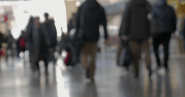 A crowd of people walking
